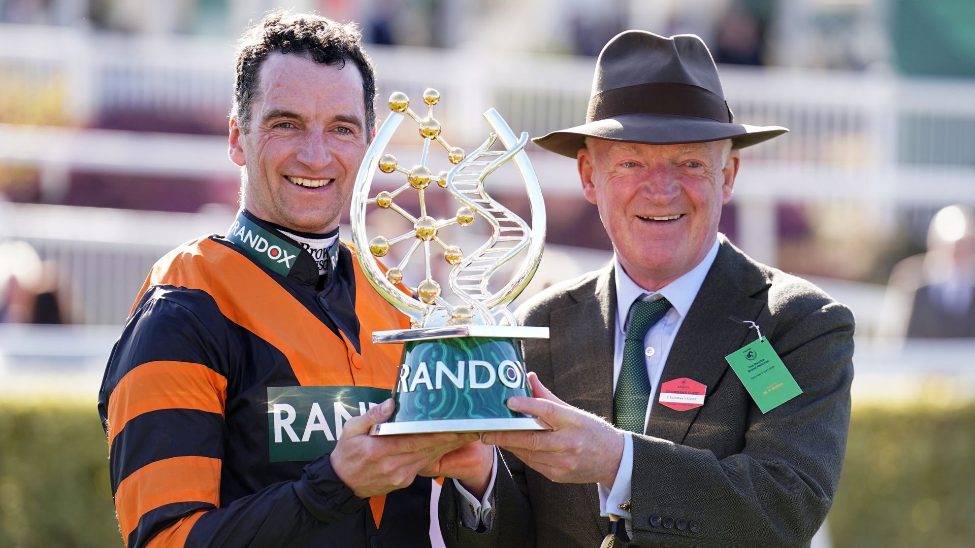 Amateur jockey wins Grand National on horse trained by his dad