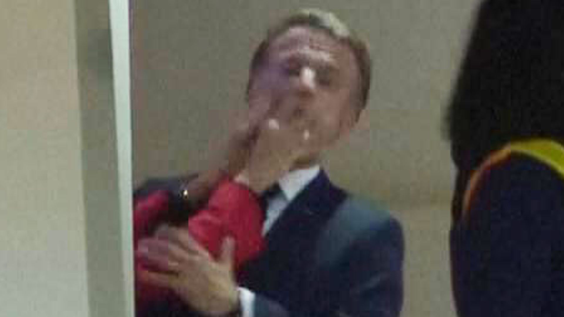 Video shows Macron being pushed in face by wife