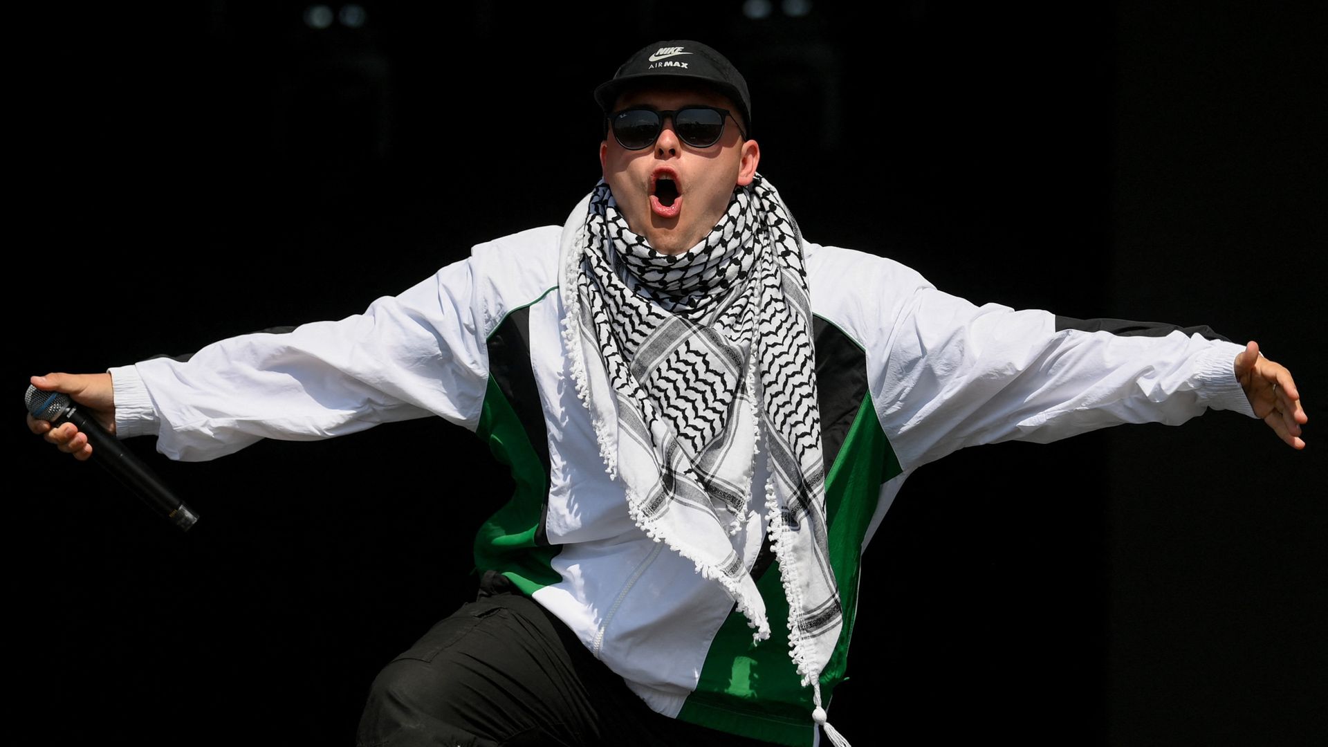 Kneecap rapper says he’s a ‘free man’ as band draw huge Glastonbury crowd