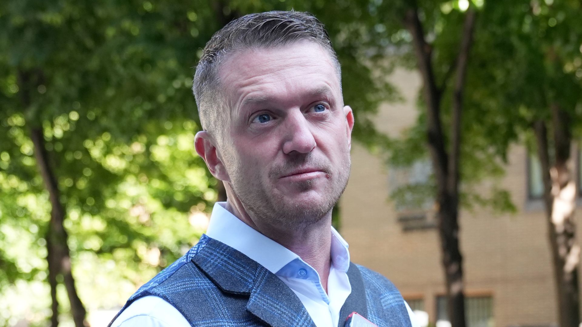 Tommy Robinson bailed after arrest over alleged assault at railway station